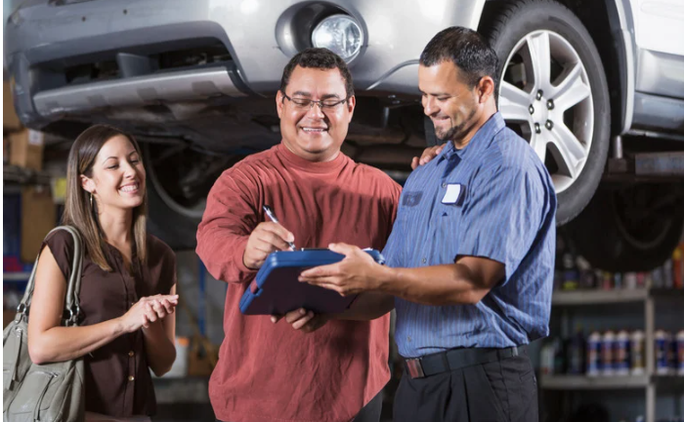 Luxury vehicle in dealership service bay